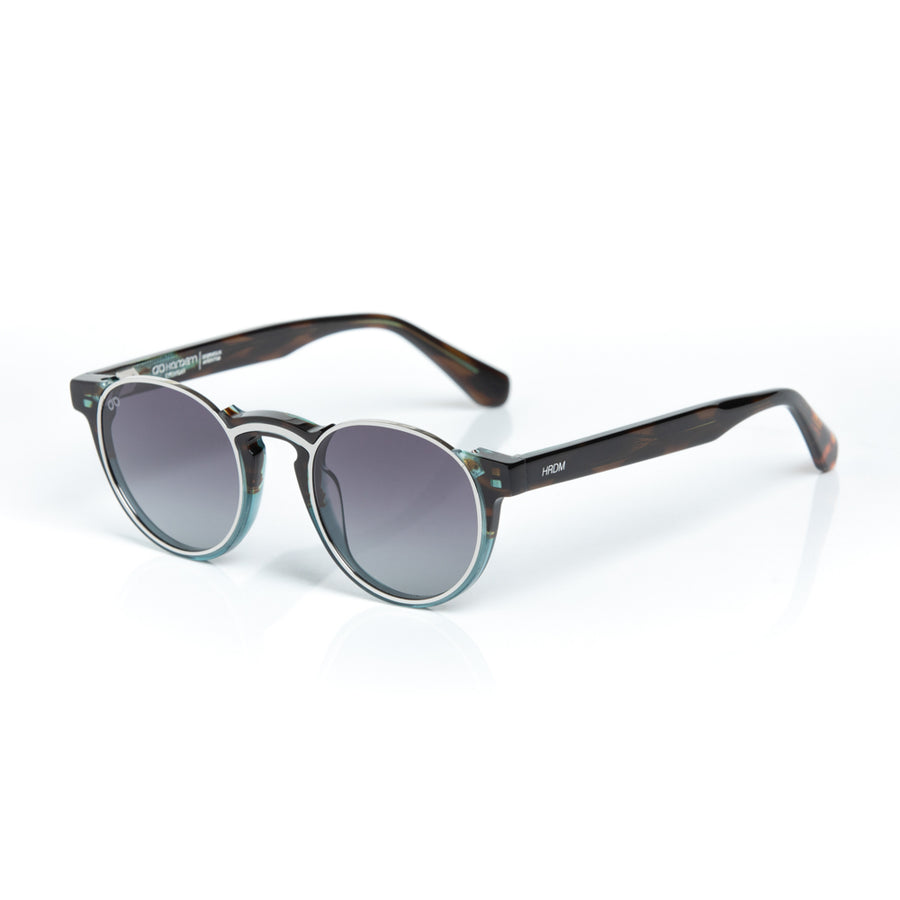 Round sunglasses with dark gradient lenses on a white background