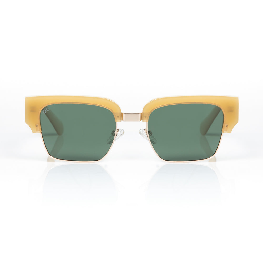 Sunglasses with beige frame and green lenses on a white background