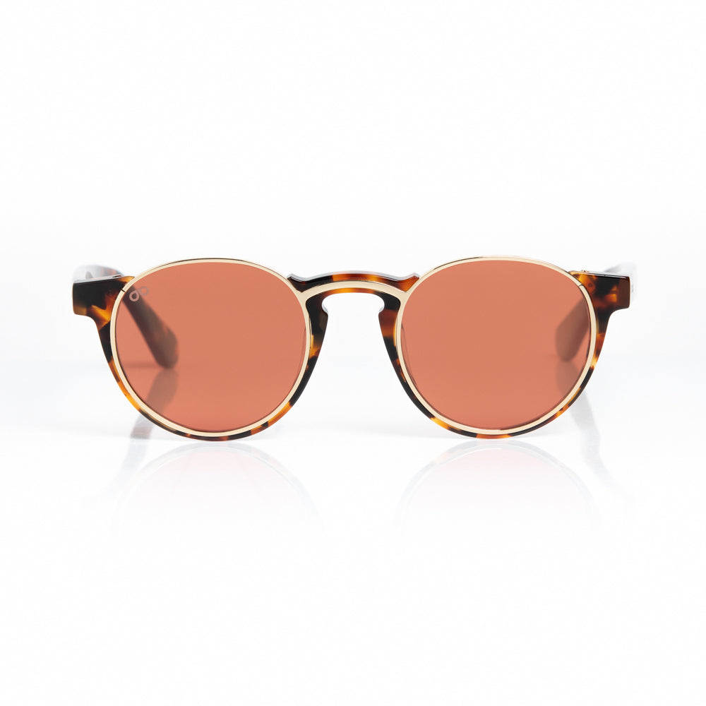 Round sunglasses with tortoiseshell frame and rose gold lenses on a white background