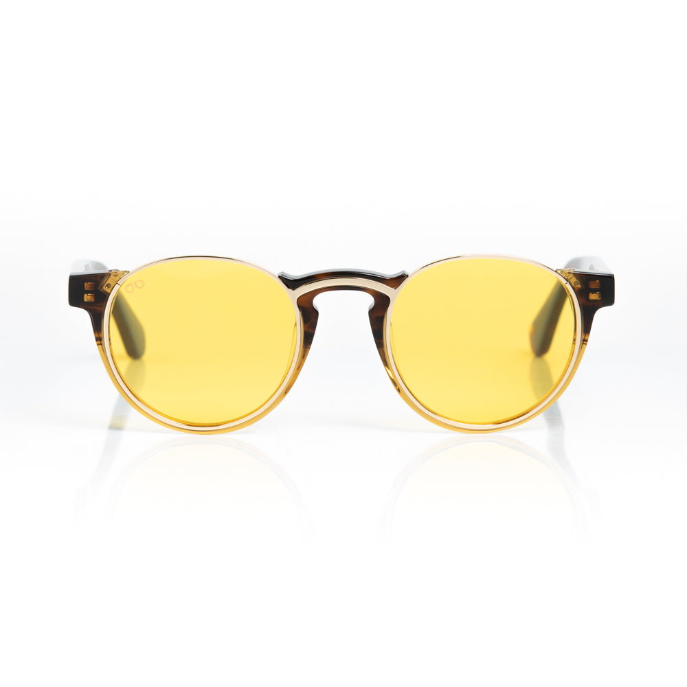 Round sunglasses with yellow lenses and brown frames on a white background