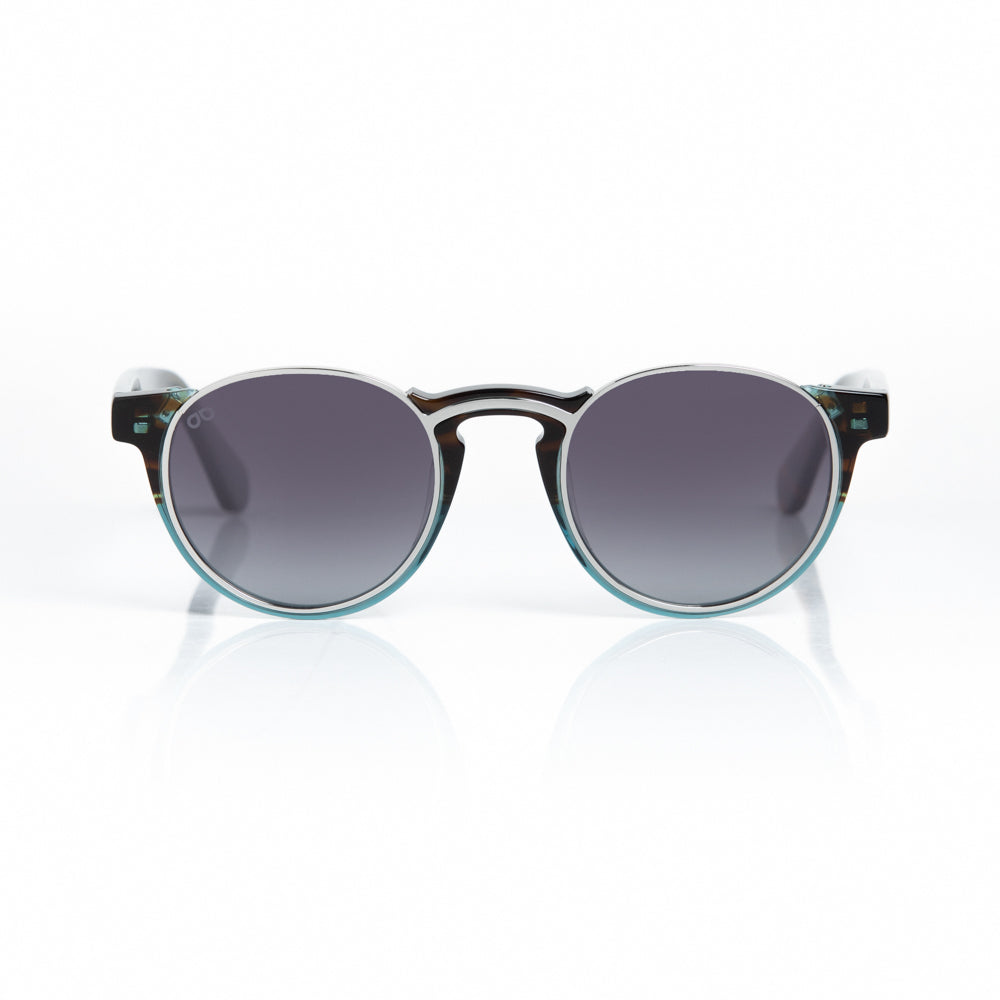 Round sunglasses with a black and green frame on a white background