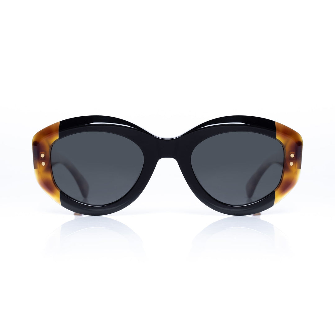 Sunglasses with tortoiseshell frame and dark lenses on a white background