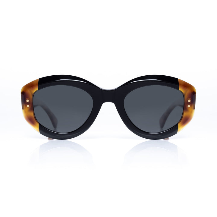 Sunglasses with tortoiseshell frame and dark lenses on a white background