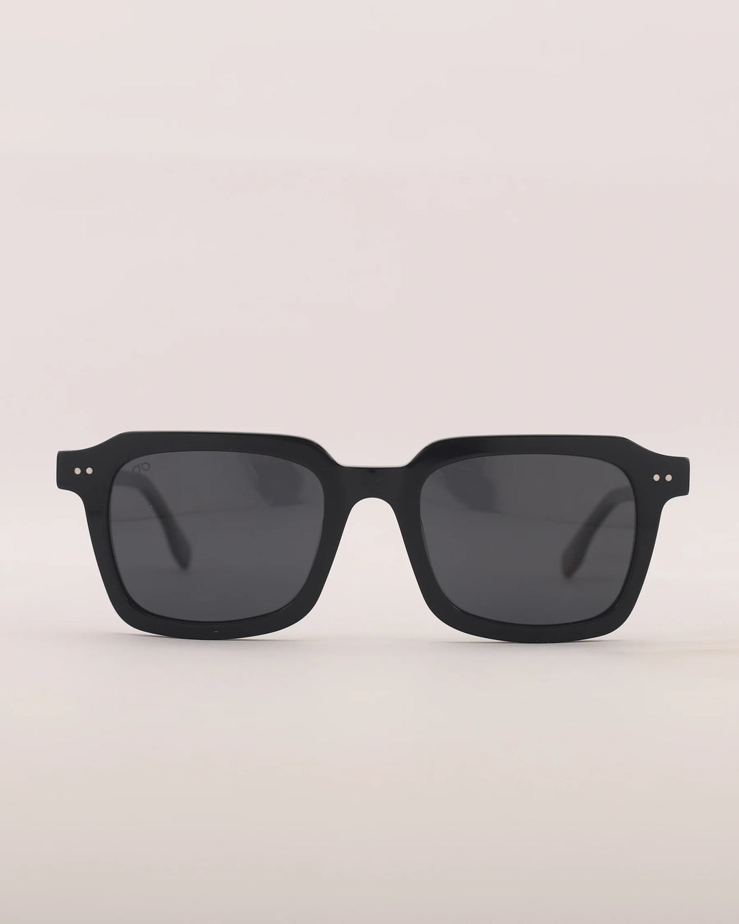 Black sunglasses on a light gray background