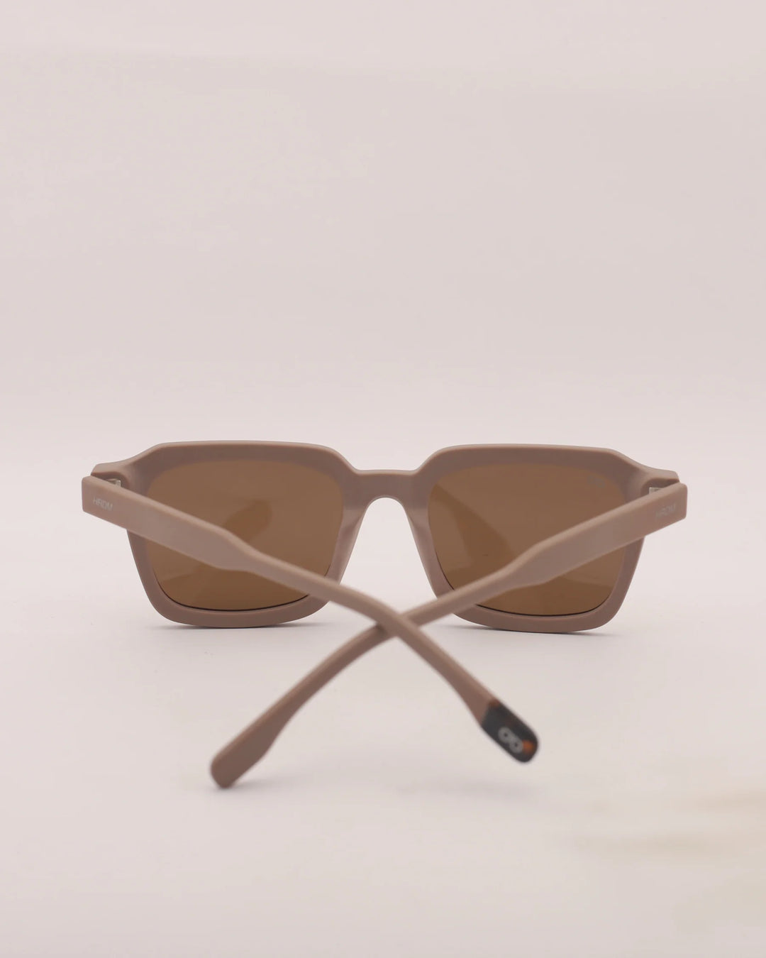 Brown sunglasses with a plain background
