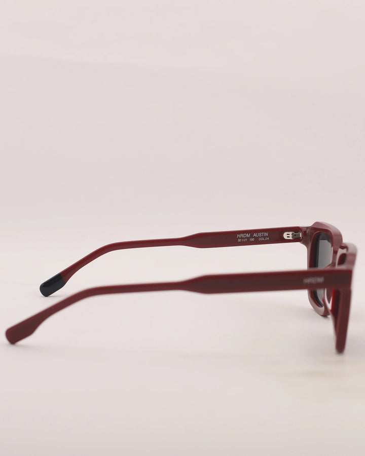 Red sunglasses with a white background