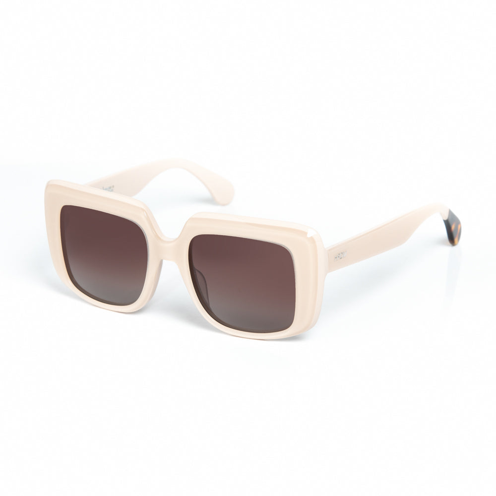 Beige sunglasses with dark lenses on a white background