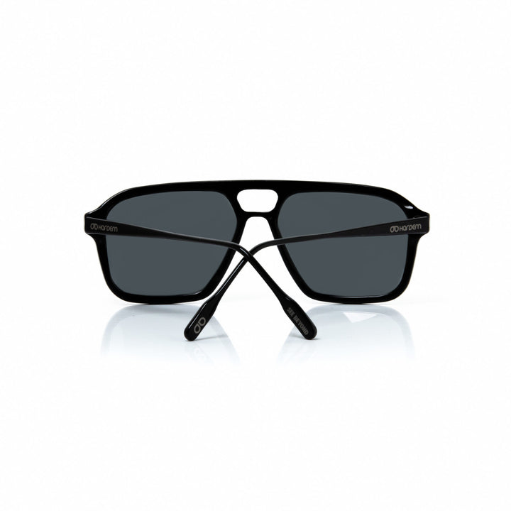 Black sunglasses with a reflective surface on a white background