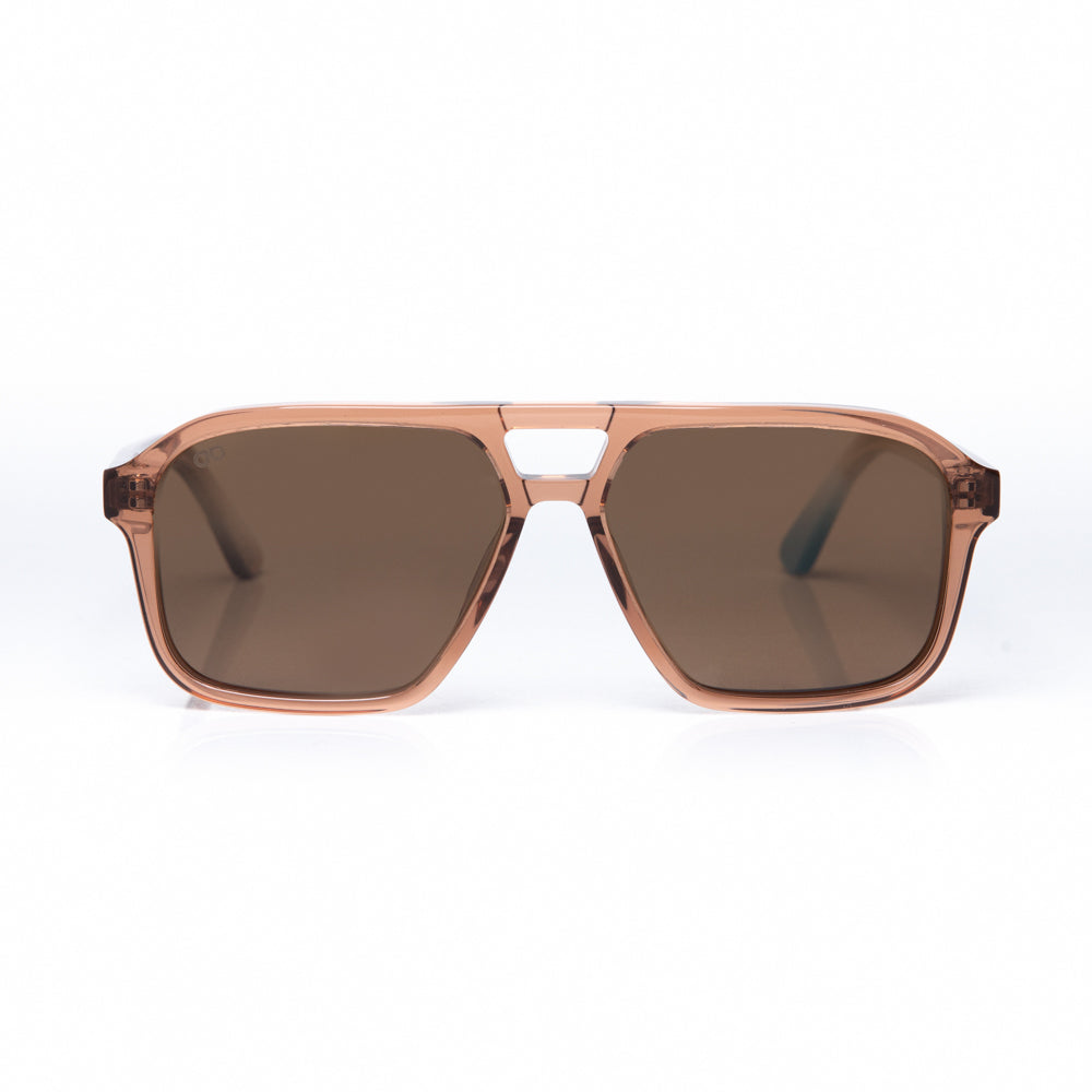 Sunglasses with brown lenses and rose gold frame on a white background