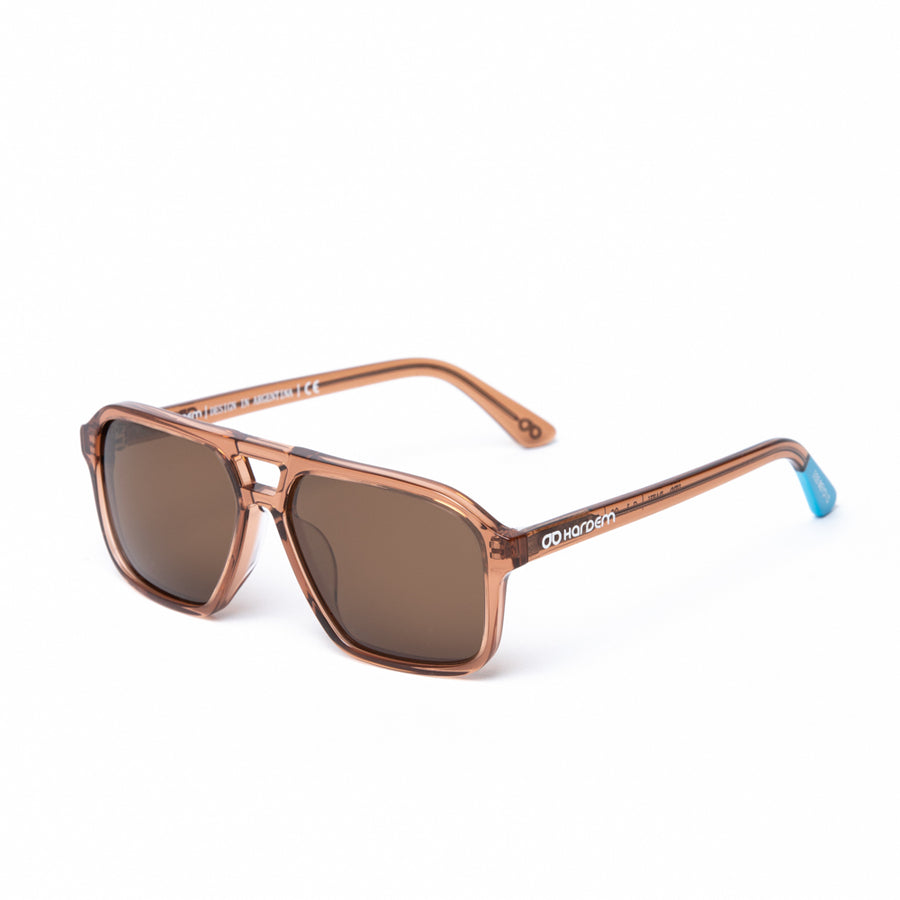 Brown sunglasses with a blue tip on a white background
