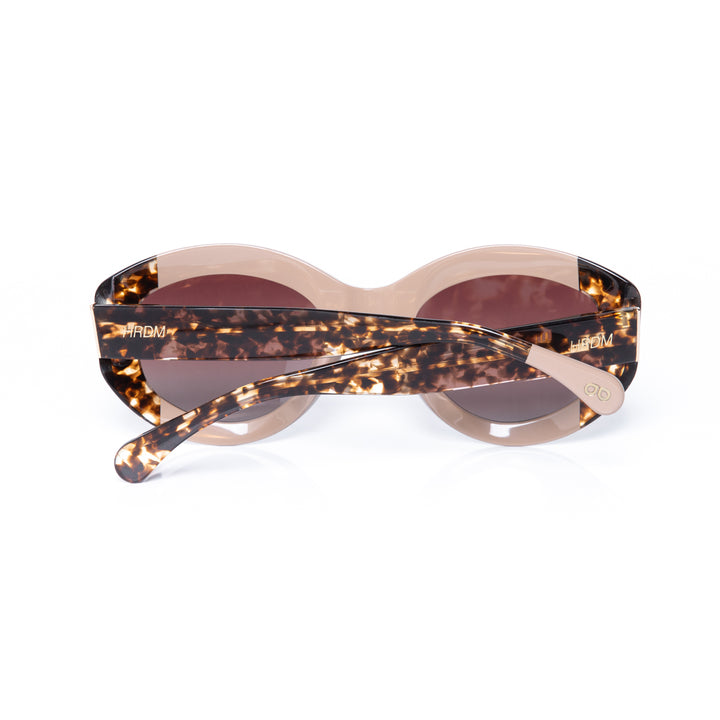 Sunglasses with tortoiseshell frame and brown lenses on a white background