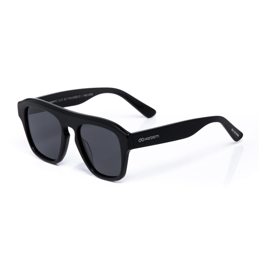 Black sunglasses with a brand logo on a white background