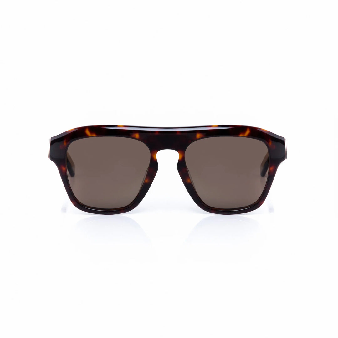 Sunglasses with tortoiseshell frame and dark lenses on a white background