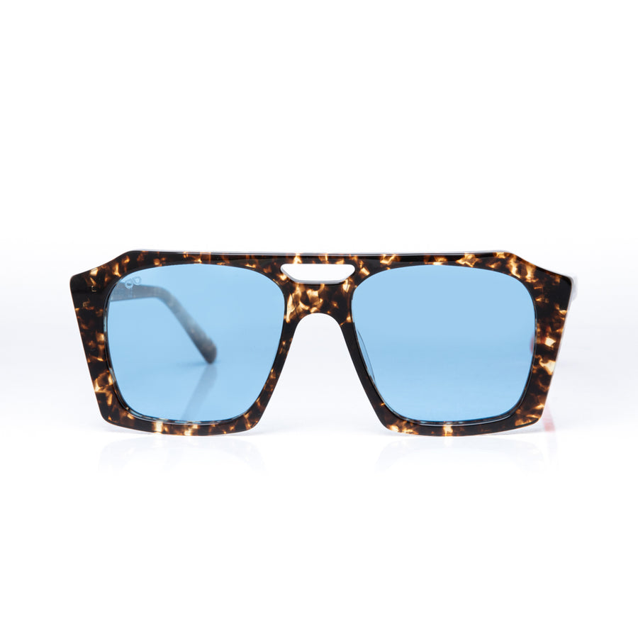 Sunglasses with tortoiseshell frame and blue lenses on a white background