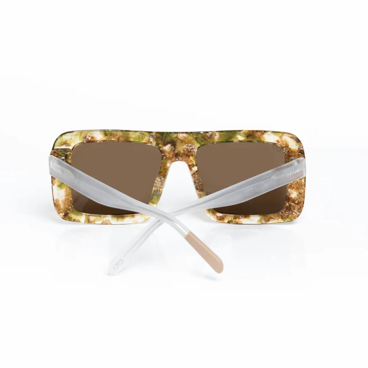 Sunglasses with tortoiseshell frame and brown lenses on a white background
