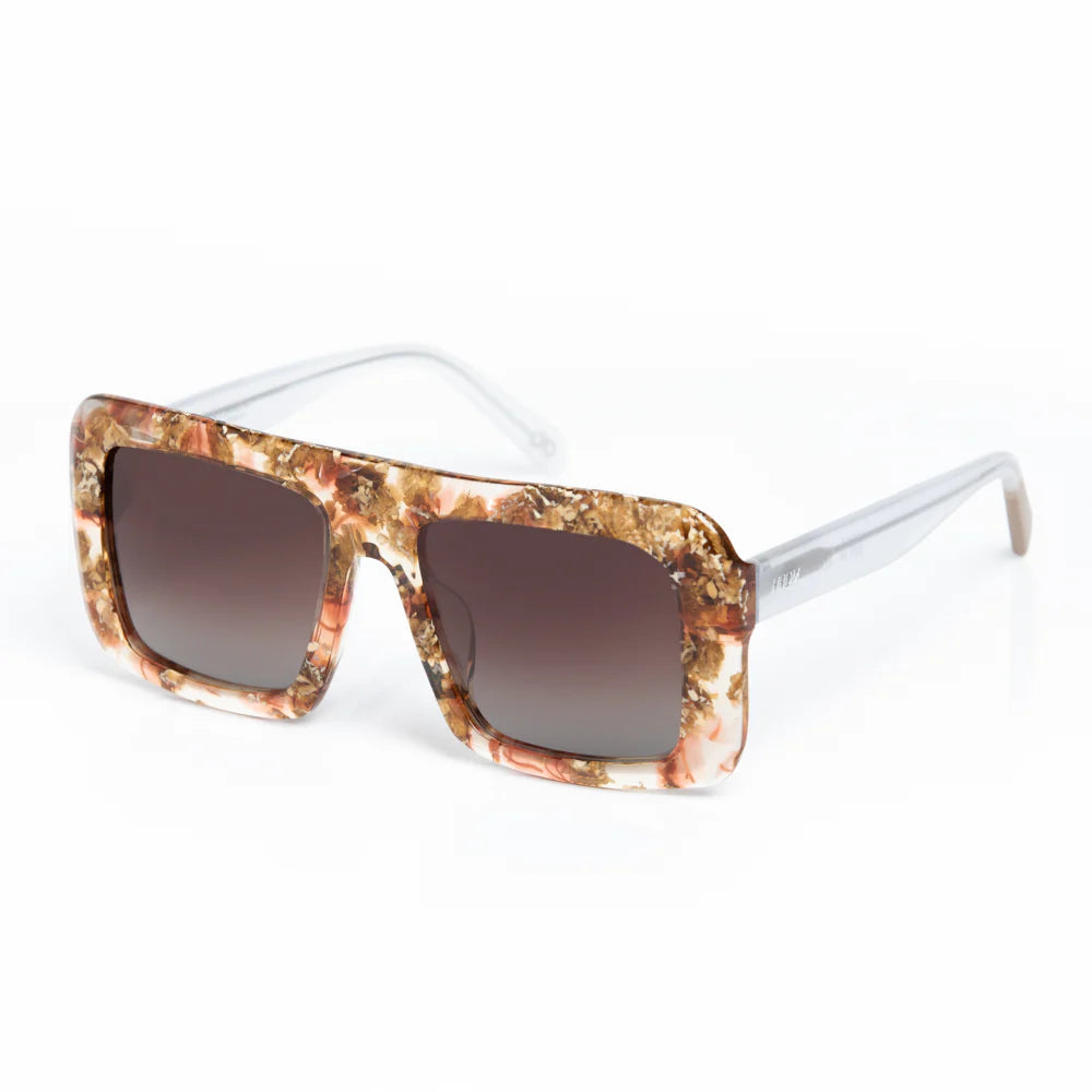 Sunglasses with a marbleized frame and dark lenses on a white background