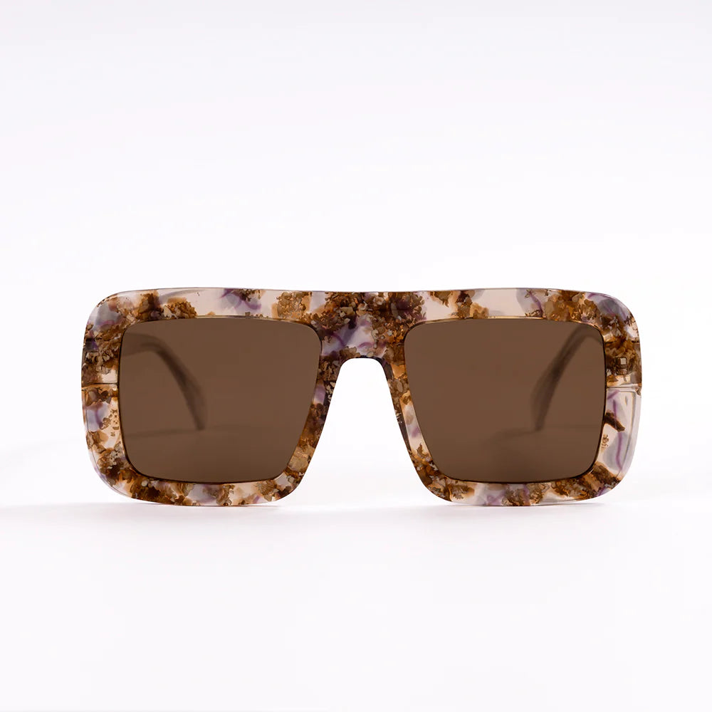 Sunglasses with tortoiseshell frame and brown lenses on a white background