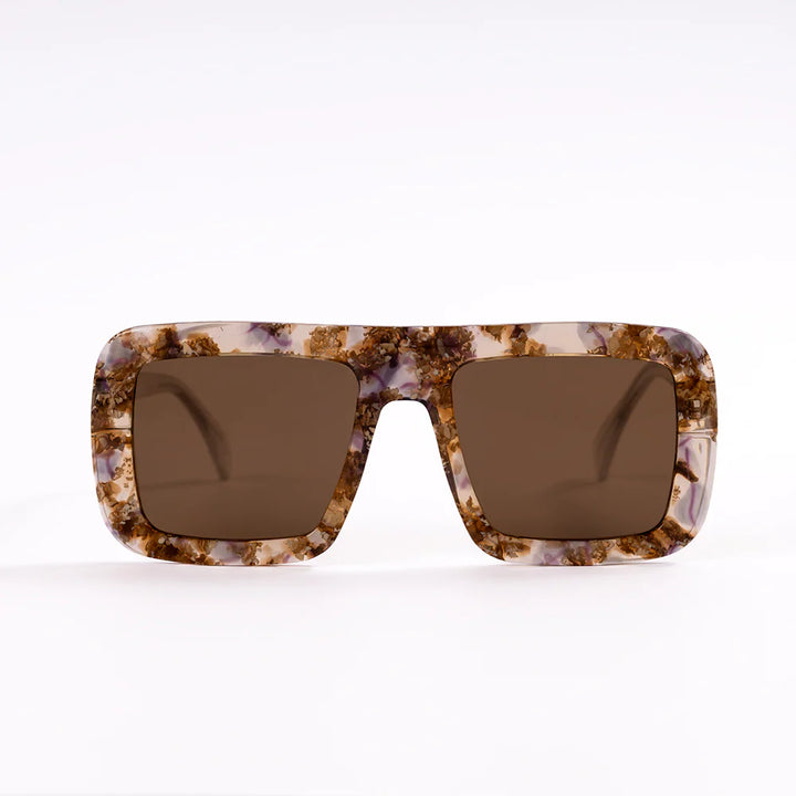 Sunglasses with tortoiseshell frame and brown lenses on a white background
