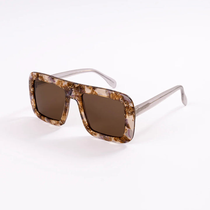 Sunglasses with tortoiseshell frame and brown lenses on a white background