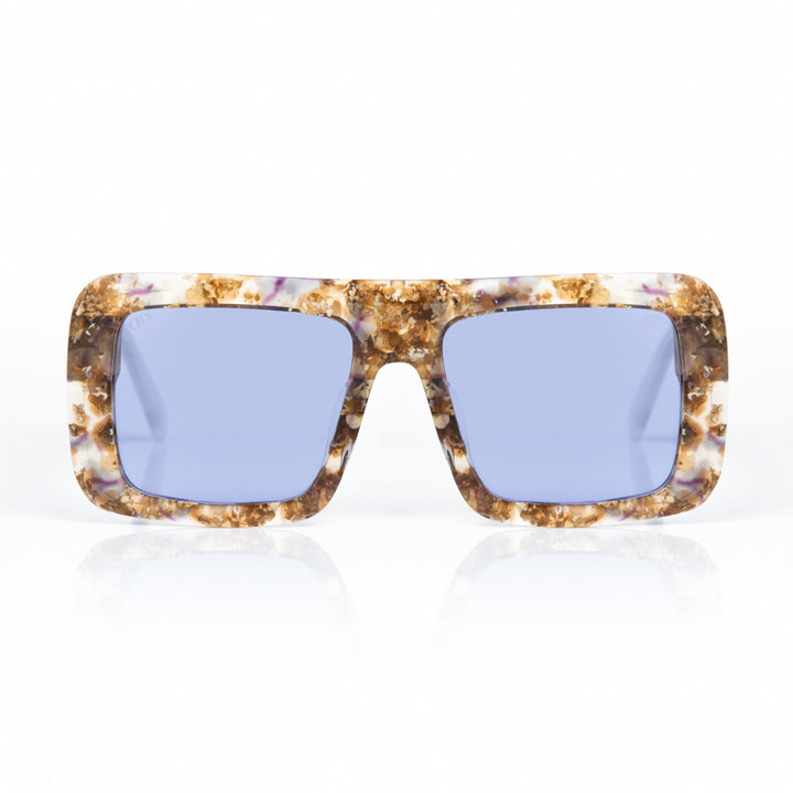 Sunglasses with tortoiseshell frame and blue lenses on a white background