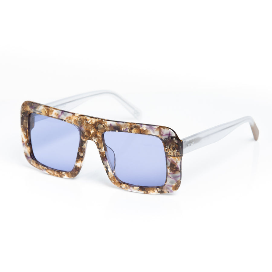 Sunglasses with tortoiseshell frame and blue lenses on a white background