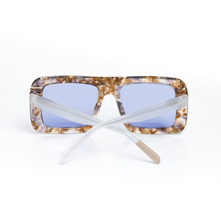 Sunglasses with tortoiseshell frame and blue lenses on a white background