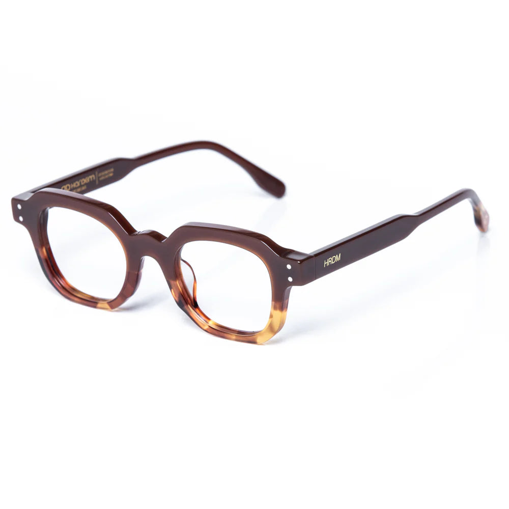 Brown and tortoiseshell eyeglasses on a white background