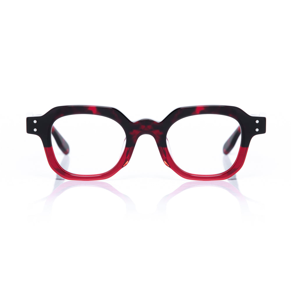 Red and black eyeglasses on a white background