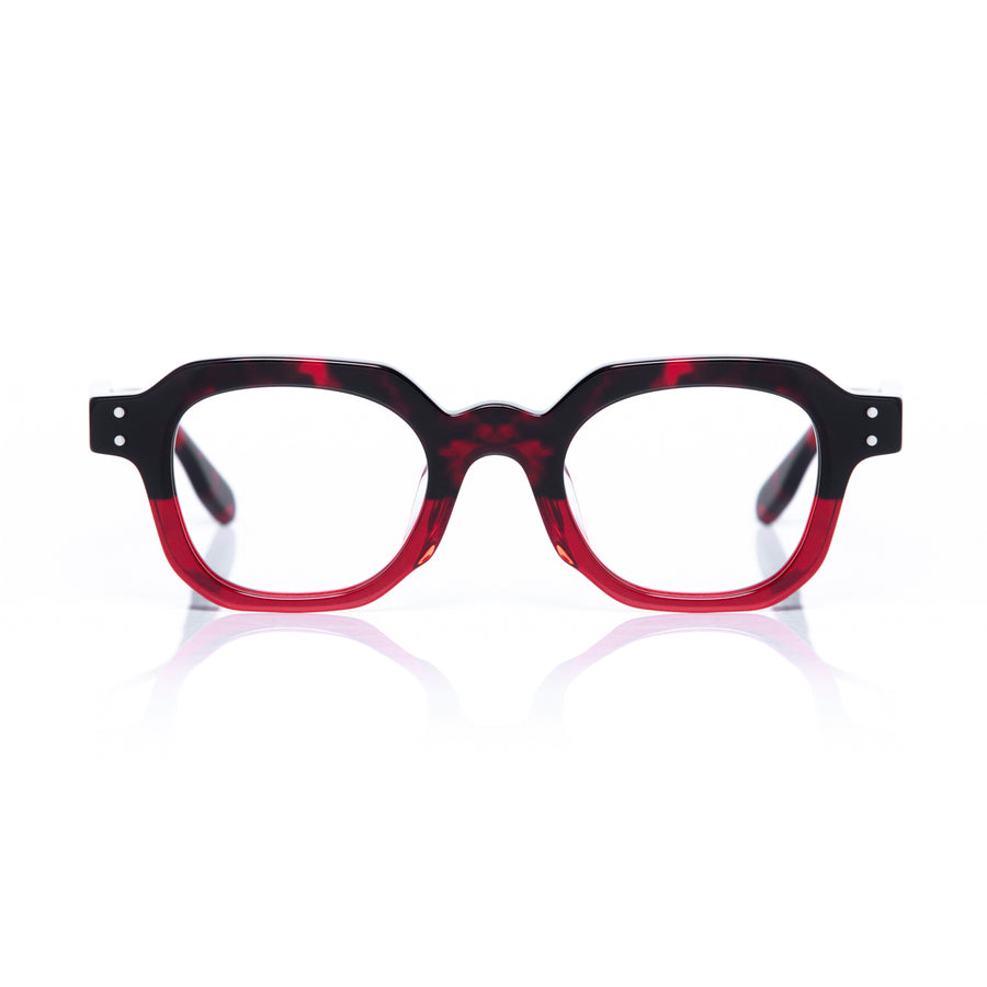 Red and black eyeglasses on a white background