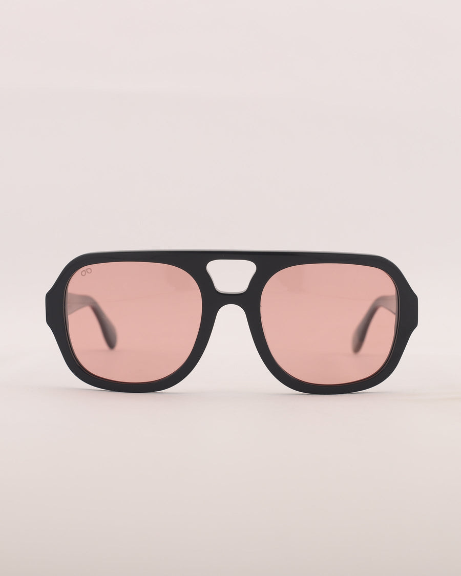 Black sunglasses with pink lenses