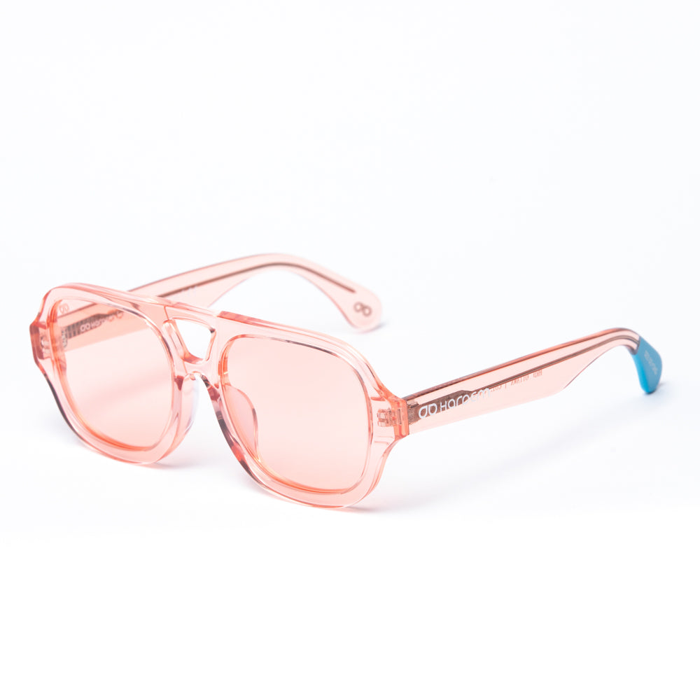 Pink sunglasses with a blue tip on a white background